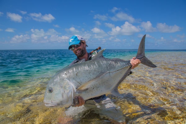 Olive White of Abaco Lodge with a hefty catch from the Seychelles.